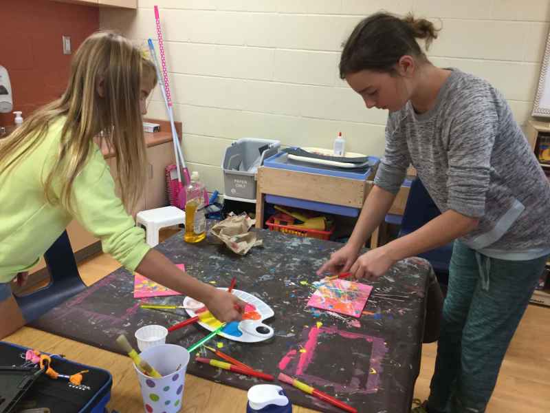 school-age kids painting